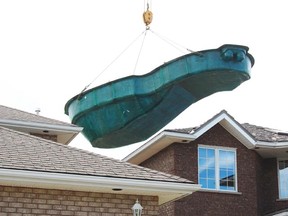 The Dolphin II pool, installed by Tarini Wet 'n Wild Pools and Hot Tubs at a New Sudbury residence, measures 38 feet by 16 feet and required a 300-tonne crane to be lifted to the back yard. Jonathan Migneault The Sudbury Star