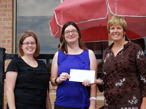 Big Brothers Big Sisters St. Thomas-Elgin handed out prizes from an earlybird draw on Wednesday. The prizes included a dress, limousine ride and a series of gift certificates meant to help the winner prepare for a gala celebration on Sept. 14 that will mark the 100th anniversary of the organization's national office. Pictured are Marcy Pearce, left, of event sponsor Wendy's with winner Emily Dyson and Big Brothers executive director Barb Matthews.