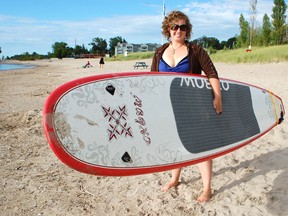 Pam Rantz opened Kincardine Stand Up Paddle Board Rentals in June 2013 on Station Beach and hasn’t slowed down since, even in the recent poor weather. (ALANNA RICE/KINCARDINE NEWS)