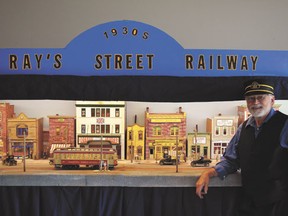 Ray Clifford in front of his model of a 1930s streetscape on display at the Leduc West Antique Society’s annual exhibition on July 27.