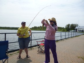 Michelle, left, and  Monia enjoy fishing during an outing at Porcupine Lake  provided by the Canadian Mental Health Association.