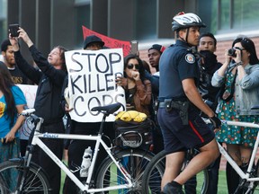 People gather at a demonstration at Dundas Square on July 27, 2013.