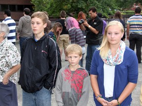 Jill Sheeler, plays the part of a bully, while launching a verbal assault on her victim, played by Mackenzie Lumley, as several people stand in a circle with their backs to what's going on. Rick Walker, of Maverick Multimedia Inc., filmed the action, Friday, Aug. 2, 2013 for a public awareness video on bullying, sponsored by the Chatham-Kent Gay Pride Association.