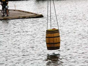 A crane lowers world renown escape artist Dean Gunnarson into Lake of the Woods as part of his Saturday afternoon performance at Harbourfest. 
MARNEY BLUNT/DAILY MINER AND NEWS