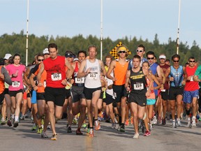 Runners take off from the start of the Shore to Shore Race from Oliphant to Wiarton on Monday. (JAMES MASTERS The Sun Times)