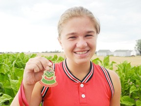 Courtney Gilbert, 15, holds her Provincial Women's Softball Association championship medal. She recently travelled with the Brantford Bobcats to P.E.I. to compete in the Softball Canada U16 Girls Fastball Championship. (SARAH DOKTOR Delhi News-Record)