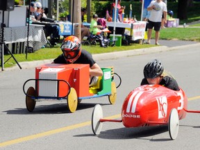 Shannon McLeod of Port Dover breezes across the finish line to win the senior final of the inaugural Uncle John’s Soap Box Derby at the Simcoe Rotary Friendship Festival Monday morning. In the far lane is runner-up Jordon Ferris of St. Williams. McLeod’s racer also won the trophy as the best in the event. (MONTE SONNENBERG Simcoe Reformer)