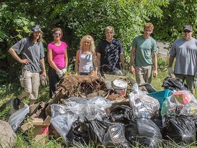 Members of the Grand River Environmental Group gather several bags of garbage from trails around Mohawk Lake on Sunday. (Submitted photo by Christopher Scott Berwick)