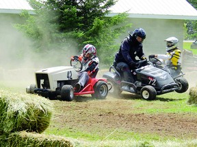 A couple of machines collide during one of the heats of Saturday's lawn tractor races, a new event for the third annual Eganville Fair, held at the Legion Memorial Field.