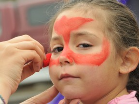Kaylee Baillargeon, 3, gets her face painted.