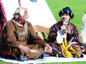 In this file photo, Roger Fleury (left) portrayed Chief Tessouat and Claudia Gleason portrayed Samuel de Champlain during a reenactment of Champlain's arrival on Morrison Island 400 years ago.