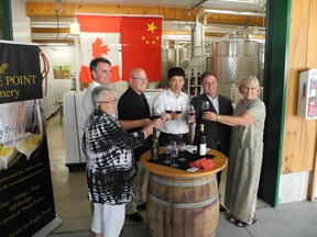 Debra Marshall, Tom Lawler, Steve Clark, Zhongyi Du, Gord Brown and Wendy Merkley raise a glass to Eagle Point's first shipment to China.
WAYNE LOWRIE Gananoque Reporter