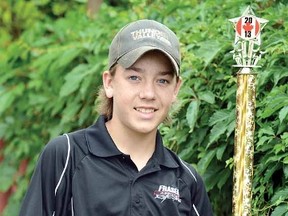 Braydon McCann, shown with his championship trophy from the recent Canadian Nitro Nationals, will be collecting signatures on his dragster to raise money for Childcan. (SCOTT WISHART The Beacon Herald)