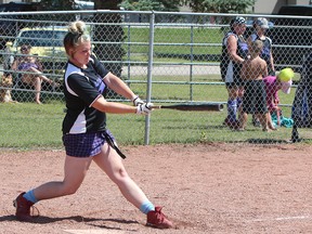 KASSIDY CHRISTENSEN NANTON NEWS/QMI AGENCY Hollie Philips, who plays for Unwanted based out of High River, hit the ball as hard as she could in hopes of belting a home run.