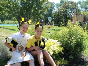 Kendra Perras, left, and Willow Stevenson, both 11, are once again hosting the Bee Buster camp for young children they created two summers ago. MICHAEL PEELING/The Paris Star/QMI Agency