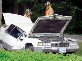 Two persons were taken to hospital by ambulance after this single-vehicle crash on Perth Road 122 south of Line 29 just outside Stratford Tuesday evening around 5:45 p.m. (SCOTT WISHART The Beacon Herald)