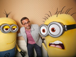 Actor Steve Carell poses with two life-size minion characters while promoting his upcoming movie “Despicable Me 2” in Los Angeles, California June 14, 2013. Lovable villain Gru is back as a doting father for “Despicable Me 2,” but while he swaps his villainous world domination schemes for princess parties, it’s his yellow, spikey-haired ‘Minions’ who rustle up trouble in the film. Picture taken June 14, 2013. REUTERS