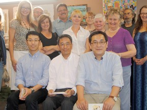 DMI President Yukichi Nakamura (front row, middle) was in Peace River on Thursday July 25 to meet with DMI’s operating committee, as well as tour the DMI Endurance Centre (gymnastics club) and the Peace Regional Municipal Library. Pictured (front row, l-r): Hideki Ando (Assistant to the Executive Vice-President), Yukichi Nakamura (DMI President) and Kazuyoshi Noguchi (Executive-Vice President) pose with Peace of Art artists and DMI and DMI staff after viewing the exhibit at the library this month called ‘Pulp Fiction’, created in partnership with DMI. LOGAN CLOW/R-G