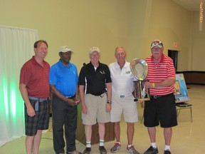 Mike Van Dorpe presents the trophy to the winners of the 2013 Panhandler Golf Classic. From Left: Nipawin Region Health Foundation Chairperson Mike Van Dorpe, Doctor Balla, Ron Saretzky, Larry Brakstad and Chester Stankowski.