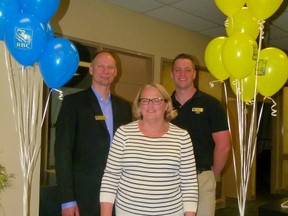 Shirley Doll posed for a photo with manager Jeff Owen and her replacement Terry Belisle the day she celebrated her retirement from RBC Fairview branch.