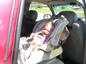 Lillian Richards happy in her newly inspected and adjusted car seat