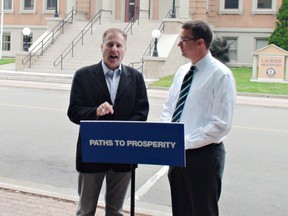 Monte McNaughton (right), the Progressive Conservative critic for economic development, trade and employment, and Brant PC candidate Phil Gillies, discuss Tory polices to create more jobs through improved skills training programs, in a presentation Wednesday. (Michael-Allan Marion, The Expositor)