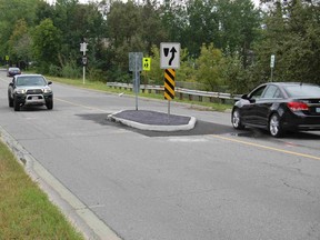 The city built a raised median island on Attlee Avenue to narrow the road and calm traffic. / The Sudbury Star