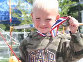 Jace Evans takes home the Flight A first place medal and a bag of goodies with a 1.17-lb bass on the opening day of the Shaw Kenora Bass International Kids Tournament in 2012.
FILE PHOTO/Daily Miner and News
