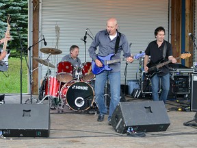 Attaboys performed to an appreciative crowd, who braved the rain and wet conditions, at Hollinger Park Wednesday night for the Timmins Summer Concert Series. The other band on the bill was Leslie Anne Dupuis & First Line. The series of concerts in the park will be held every Wednesday throughout the summer from 6:30-9:30 p.m. Next week, there are two acts scheduled: LOA and Good Time Band. The concerts are free, however there is a voluntary collection to support the Timmins Food Bank and South Porcupine Food Bank.