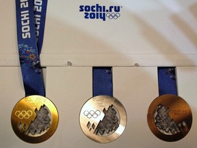 Medals for the 2014 Winter Olympic Games in Sochi are seen on display during a presentation in St. Petersburg May 30, 2013. (REUTERS/Alexander Demianchuk)