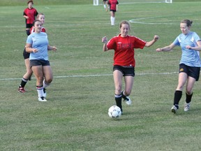 Sami Burkart of Vanz races into the Plaza 18-yard box looking for a chance to break a scoreless tie in the Kenora Women’s Soccer League quarterfinal match played Wednesday, Aug. 7, 2013. 
LLOYD MACK/Daily Miner and News