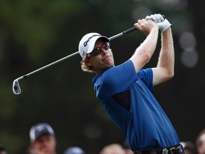 Brantford's David Hearn tees off on the 11th hole during the first round of the 2013 PGA Championship golf tournament at Oak Hill Country Club in Rochester, New York August 8, 2013. (REUTERS/Mathieu Belanger)