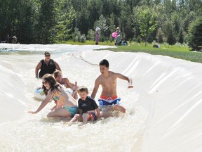 The Whitecourt and District Teen Centre participants enjoy a ride on the Rivers Slides at Rotary Park during an outing on Wednesday, July 31.
Barry Kerton | Whitecourt Star