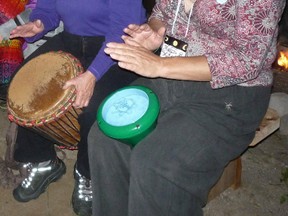 Miriam (left) and Melissa Moongoddess jam with other drummers after a ritual.