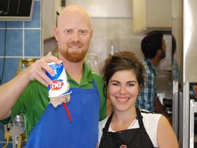 Melfort Mustangs GM and Head Coach Gavin Holcomb and Dairy Queen owner Cassie Davis practicing the art of blizzard flipping on Thursday, August 8.