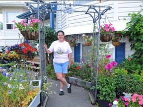 Carol Kruchten couldn’t be more proud of her spectacular garden on Lakeland Drive. With more than 200 plants and 100 ornaments decorating her outdoor refuge, the garden is an attraction and point of interest for passersby all year long. (Elizabeth McSheffrey/Daily Herald-Tribune)
