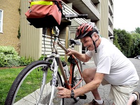 John Sigurjonsson, Cycle Chatham-Kent spokesman, inspects his bike outside his residence on Thursday. He plans to give a deputation to council Monday concerning the possible creation of bike lanes along a stretch of McNaughton Avenue West. TREVOR TERFLOTH/ THE CHATHAM DAILY NEWS/ QMI AGENCY