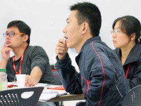 Gang Shi, left, Congguo Huang and Ming Qu, shown Thursday at Canadore College, are among 20 professors from Xuzhou Normal College in China visiting with local educators for the next couple of weeks.