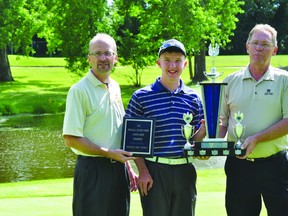 Micah Zacharias, middle, is presented with the 2013 Portage Credit Union Junior Open Championship by junior golf chair Preston Meier, left, and Portage Credit Union CEO Dave Omichinski August 8. (Kevin Hirschfield/THE GRAPHIC/QMI AGENCY).