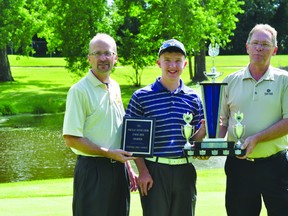 Micah Zacharias, middle, is presented with the 2013 Portage Credit Union Junior Open Championship by junior golf chair Preston Meier, left, and Portage Credit Union CEO Dave Omichinski August 8. (Kevin Hirschfield/THE GRAPHIC/QMI AGENCY