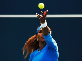 Top-seed Serena Williams launches one of her 10 aces against Kirsten Flipkens en route to an easy 6-0, 6-3 win at the Rogers Cup yesterday. (Reuters)