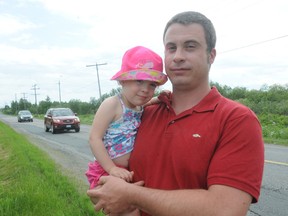 Eric Labreche and his two-year-old daughter Manon in front of his Montee Rouleau home in Azilda.
GINO DONATO/THE SUDBURY STAR