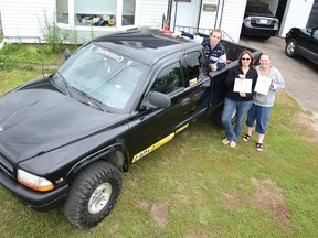 Keith Larocque, left, Annie Fudge and Brenda Markus stand with the truck of the late Alex Clarke. The popular teen's iconic vehicle will, with the help of many community business sponsors, be transformed over the summer into a mobile suicide awareness billboard, an join initiative of the Breaking the Silence group and Clarke's friends and family.