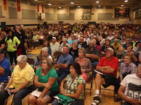 KEVIN RUSHWORTH HIGH RIVER TIMES/QMI AGENCY. Hundreds of High River residents packed the gym at Senator Riley Middle School for the community's third information meeting. This time, Minister of Municipal Affairs, Doug Griffiths, Mayor Emile Blokland and Rick Fraser were in attendance. Representatives from Tervita Corporation, Alberta Health Services and the disaster recovery program were on hand to answer questions.