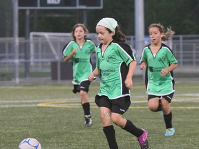 Emily Perron of the Investors Group Kelly Green team moves the ball into the offensive zone during a game at the Steve Omischl Sports Fields Complex, Tuesday. The season will soon wrap up with a North Bay Youth Soccer Club festival Aug. 24. DAVE DALE/THE NUGGET