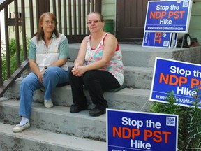 Lauri St. Germain and Linda Thomson-Bissett, left, are distributing hundreds of Stop The PST Hike signs Monday, They say they can’t get enough signs for all the taxpayers who want them. (QMI Agency photo)