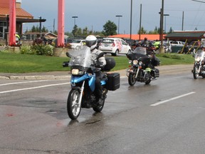 Law enforcement Torch Riders rode out of Timmins Friday on a long haul motorcycle ride that is also a fundraising effort for the Special Olympics. Timmins Times LOCAL NEWS photo by Len Gillis