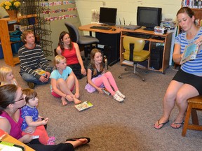 Jaime Balsom of With Love Gifts reads a book to children and their parents during story hour at the Hepworth Public Library branch located at Hepworth Central Public School. (Rob Gowan The Sun Times)