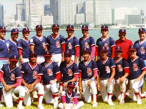 The 1984 Brockville Senior Bunnies are pictured in Windsor with the Detroit skyline in the background. The team finished with a then-franchise record won-loss record of 44-9. Pictured back row, left to right, are coach Roger Hodgkinson, Tim Wilson, Chris Gill, Ken Babcock, Peter Hoy, Shawn Ogilvie, Mike Hoy, Duncan Carlyle, coach Jack Giffin and coach Wayne Hamelin. Front row left to right are Derrick Burns, Scott Wingeat, Chris Ross, Kevin Harper, King Yee Jr., Dan Burns, Bill Loshaw and Jason White. Seated in front is batboy Doug Hamelin. (SUBMITTED PHOTO)