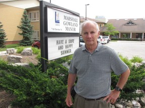 David Harris, stands out front of Marshall Gowland Manor in Sarnia. He's looking for answers about how his 101-year-old father broke his leg while at the nursing home. PAUL MORDEN/ THE OBSERVER/ QMI AGENCY